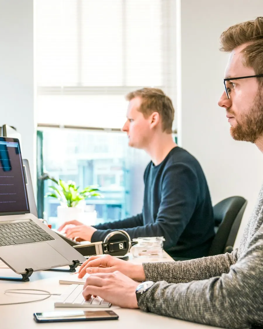Person managing a CRM dashboard on a laptop